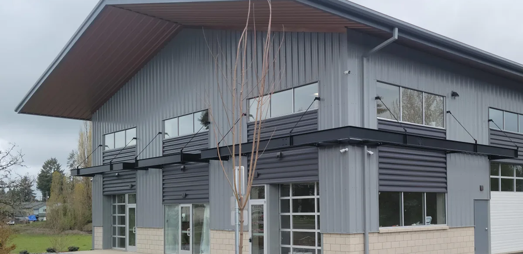 Gray metal-clad structure with glass doors