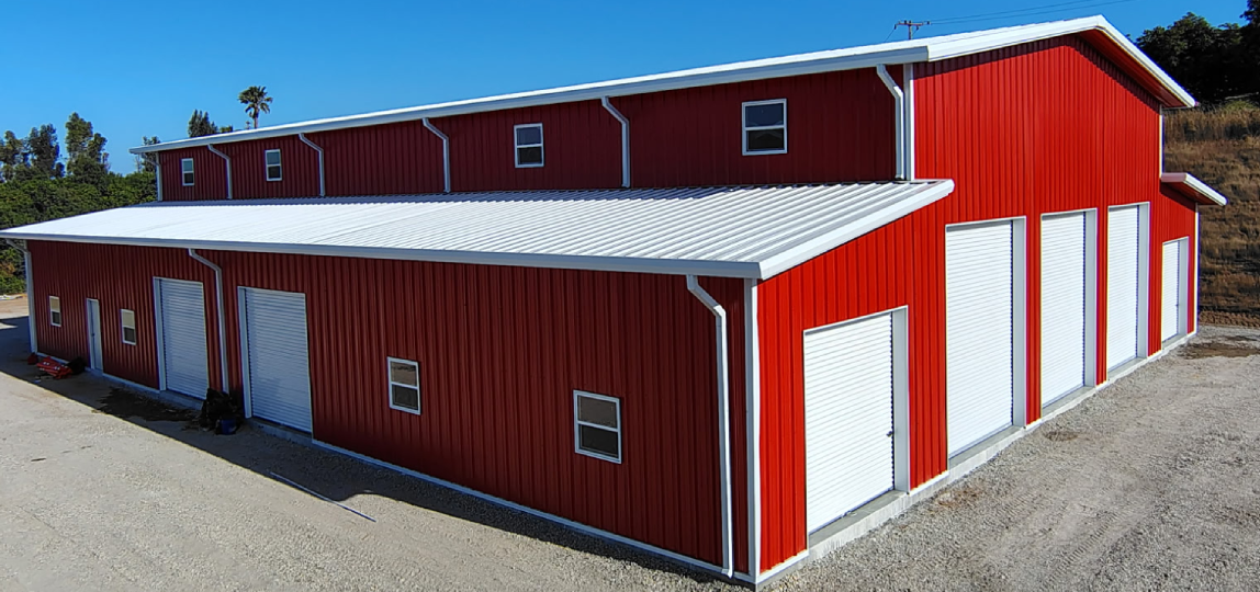 Red metal warehouse with white doors